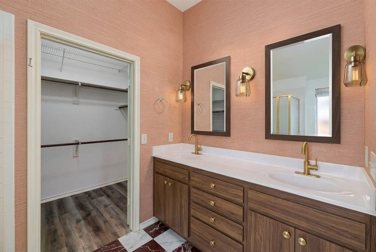 The same bathroom redesigned in the clay and oxblood style.